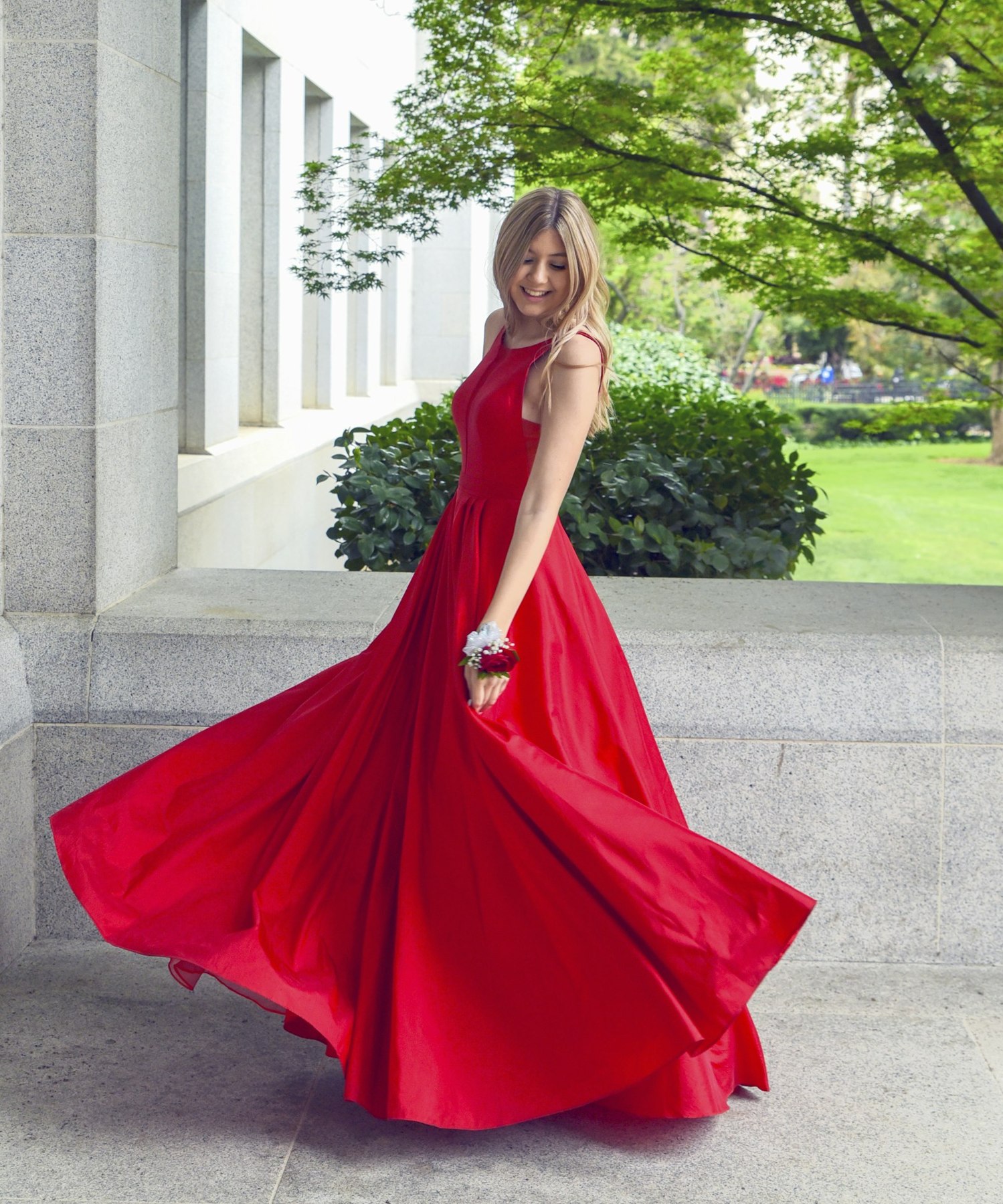 Flowing scarlet maxi dress in an outdoor setting